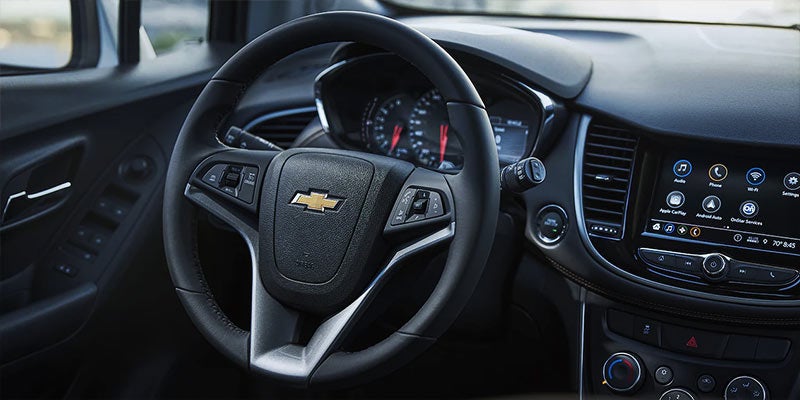 Chevrolet Trax LT interior with touchscreen and steering wheel.