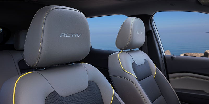 Front seats of a Chevrolet SUV featuring ACTIV-branded upholstery with contrast stitching and premium interior materials
